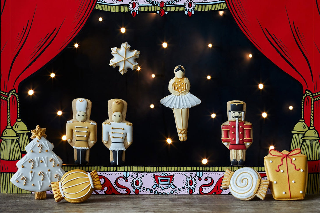 Nutcracker-themed Biscuiteers biscuits: soldier, ballerina shapes, perfect for Christmas gifts, handcrafted and personalized.