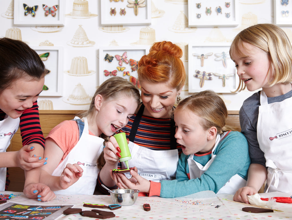 Children's Icing Party set with hand-iced biscuits, perfect personalised birthday gift for kids, in a decorative biscuit tin.