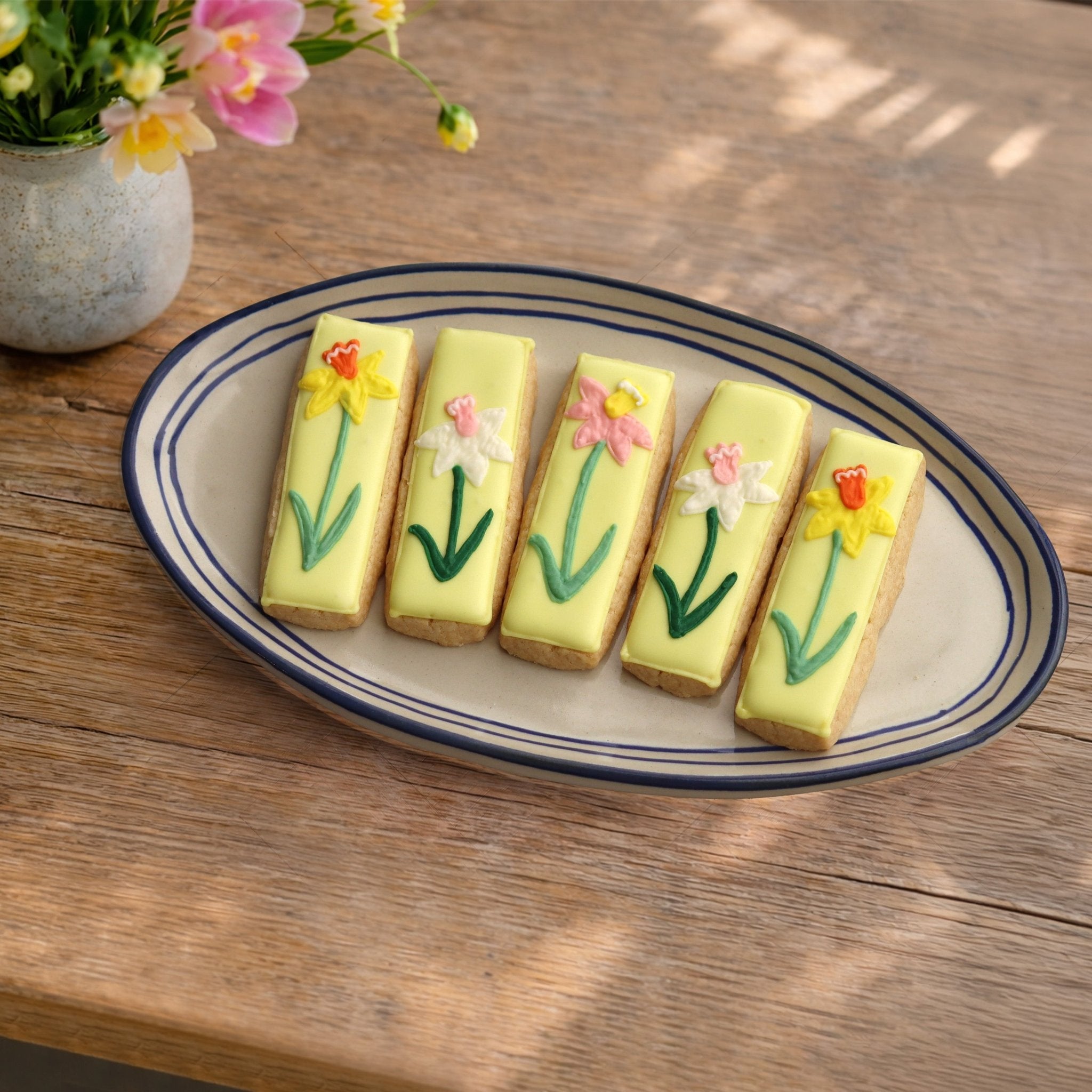 Iced Shortbread laid on a plate - Biscuiteers