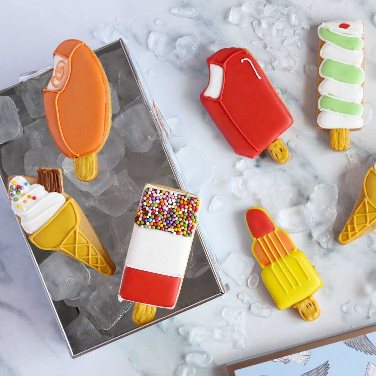 Hand-iced Ice Lollies Letterbox Biscuits in a tin, perfect personalised birthday gift or treat, vibrant and colorful design.